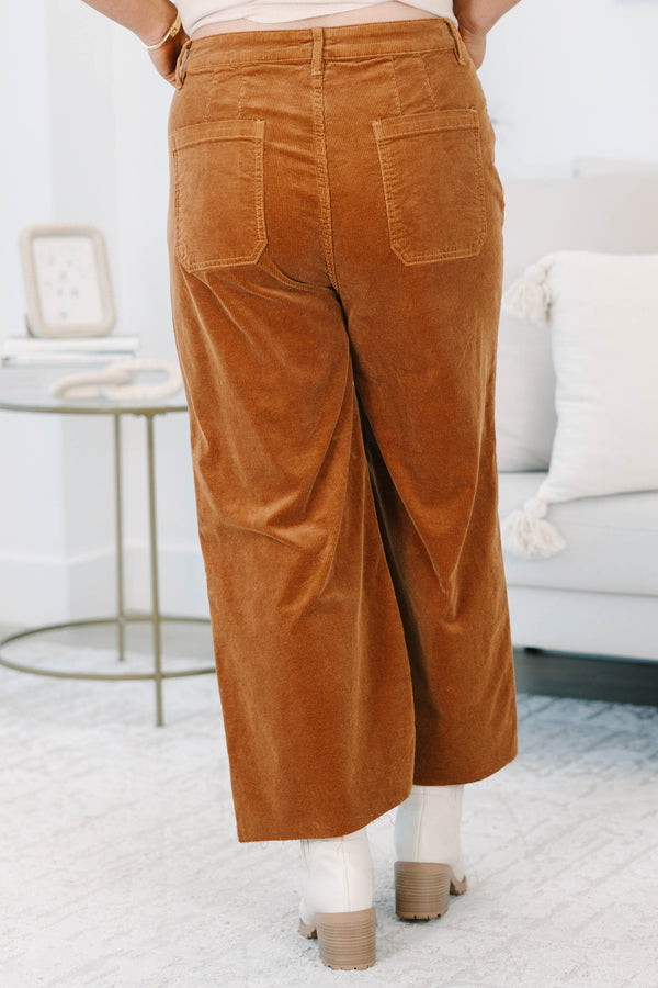 Plus Size brown corduroy wide-leg pants with front patch pockets and a raw hem.