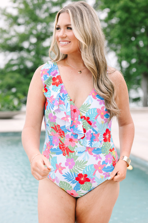 Plus Size one-piece swimsuit with a tropical floral print, V-neckline, and ruffle detail.