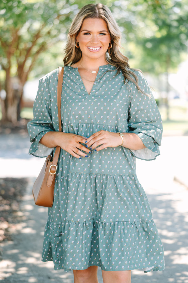 Plus Size green babydoll dress with a split v-neck, mini bell sleeves, and a floral polka dot print.
