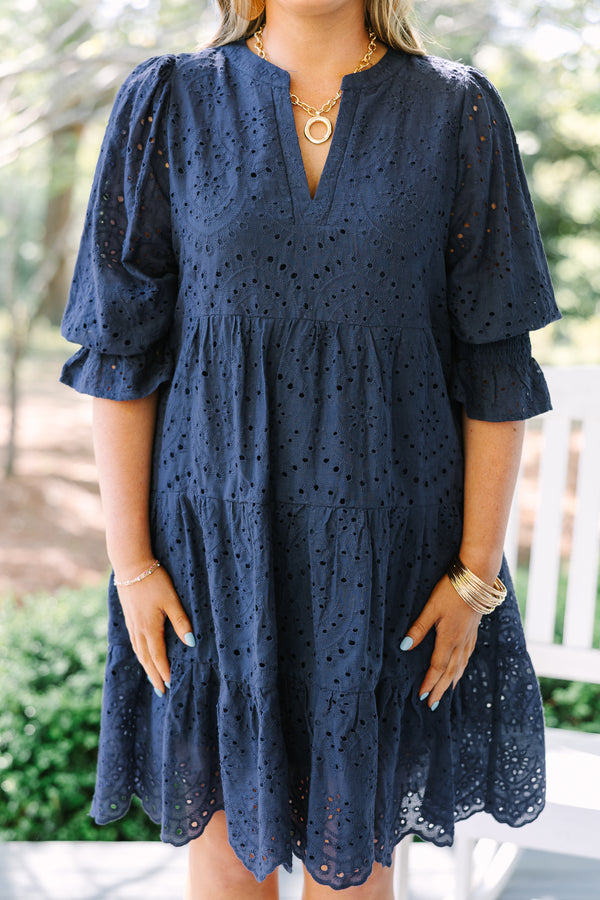 Chic Soul plus size clothing, navy mid sleeve short dress with eyelet design throughout the dress, tiered skirt, v-neckline, and cinching on the bottom of the sleeves