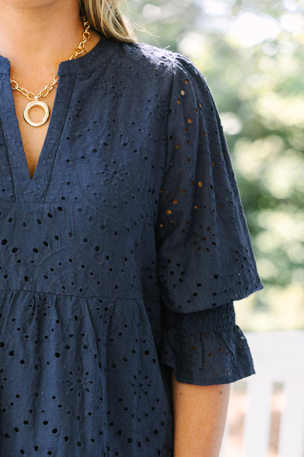 Chic Soul plus size clothing, navy mid sleeve short dress with eyelet design throughout the dress, tiered skirt, v-neckline, and cinching on the bottom of the sleeves
