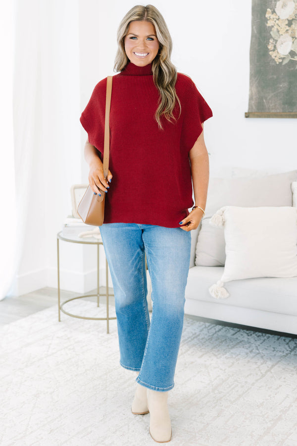 Plus size wine red mock neck sweater with cap sleeves and a relaxed knit fit.