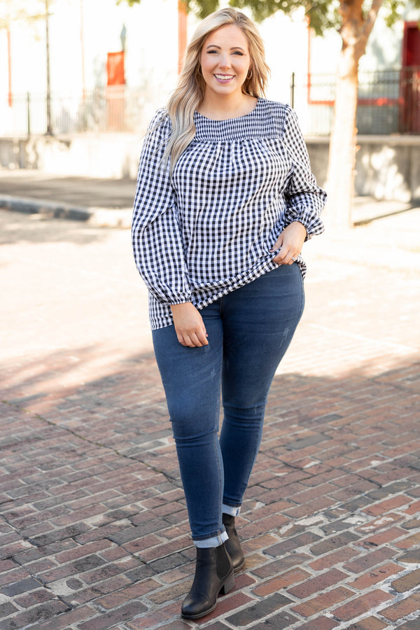 Plus Size black and white gingham top with a smocked neckline and long puff sleeves.