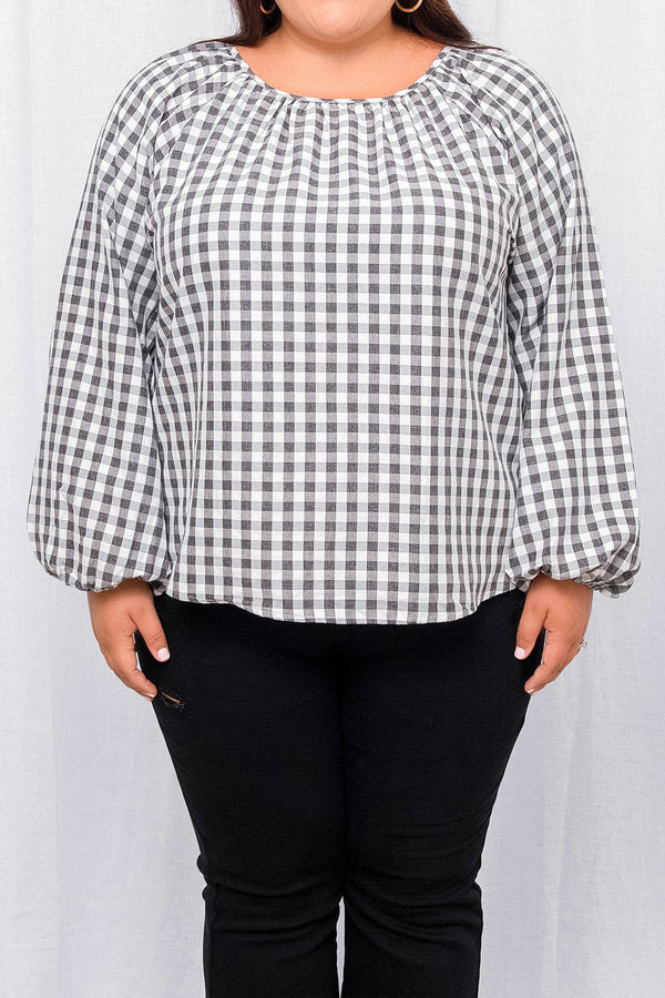 Plus Size charcoal and white gingham blouse with a gathered neckline and long puff sleeves.