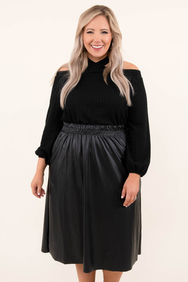 Plus Size black cold-shoulder sweater with a halter neckline and a black faux leather midi skirt.