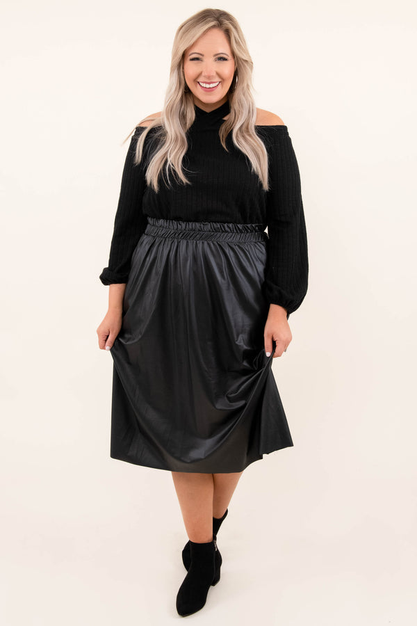 Plus Size black cold-shoulder sweater with a halter neckline and a black faux leather midi skirt.