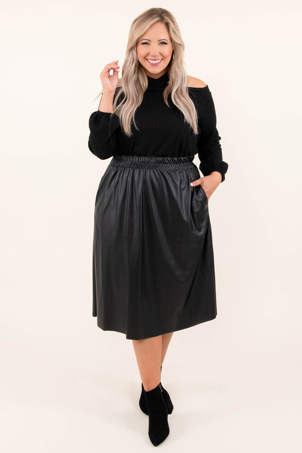 Plus Size black cold-shoulder sweater with a halter neckline and a black faux leather midi skirt.