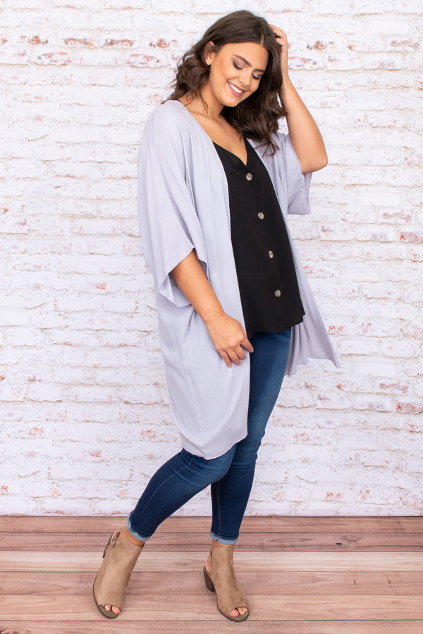 Plus Size grey open-front kimono with oversized fit and wide sleeves over a black button-up top.