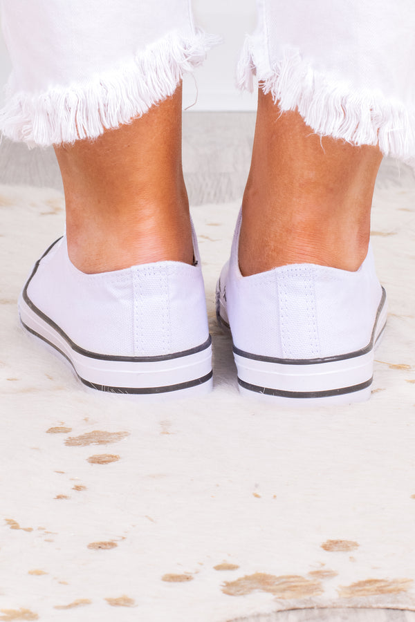 Plus Size white low-top canvas sneakers with white laces and a black stripe on the sole.