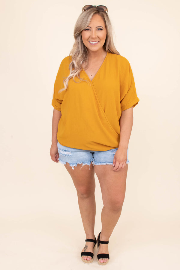 Plus Size light wash denim shorts with distressing and frayed hems.