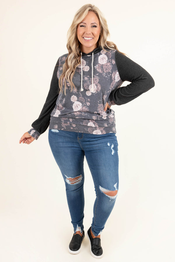 Plus Size medium wash distressed skinny jeans with ripped knees and frayed hems.