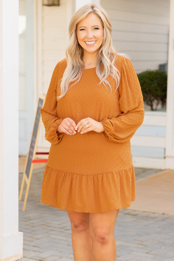 Plus Size rust-colored mini dress with Swiss dots, long balloon sleeves, and a ruffled hem.