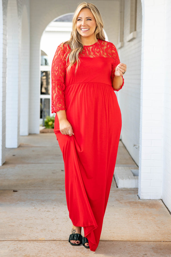 Plus Size red maxi dress with a fitted bodice, long lace sleeves, and a flowing floor-length skirt.