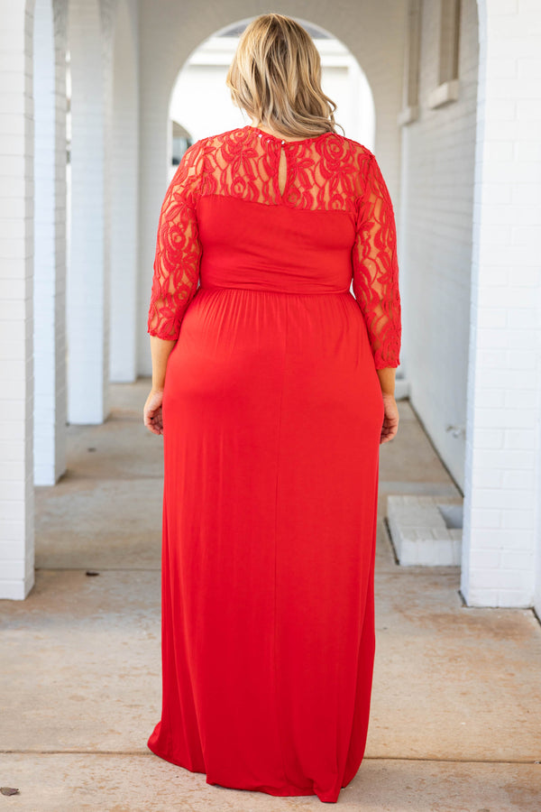 Plus Size red maxi dress with a fitted bodice, long lace sleeves, and a flowing floor-length skirt.