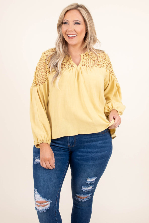 Plus Size marigold linen-blend top with lace crochet yoke, V-neckline, and long balloon sleeves.