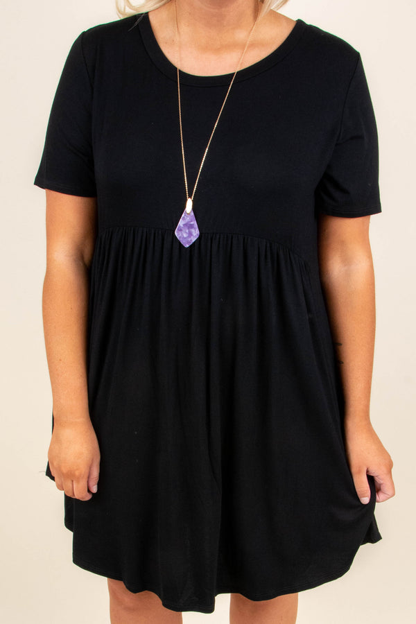 Plus Size black babydoll dress with short sleeves, a round neckline, and a breezy rayon-spandex fit.