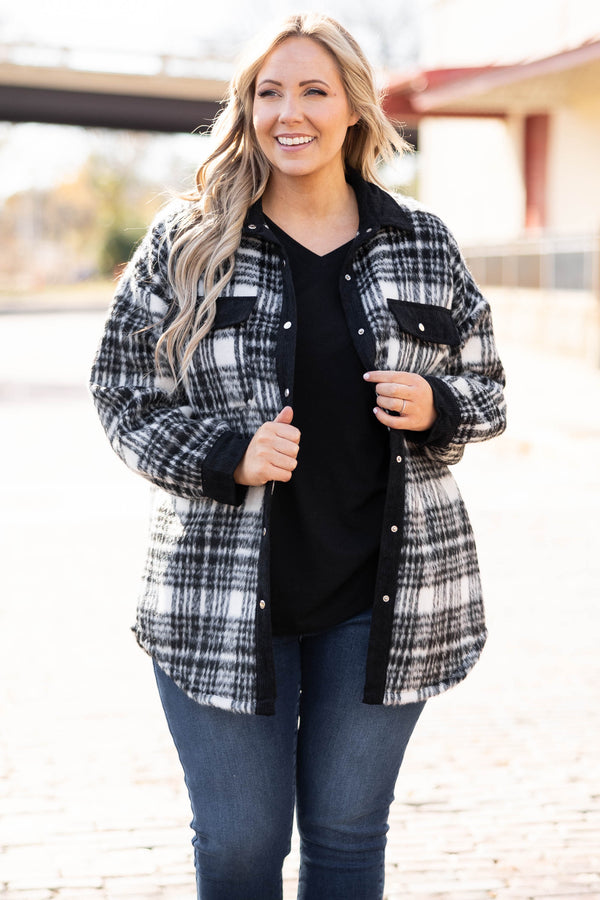 Plus Size black and white plaid shacket with a button-down front, collar, and chest pockets.